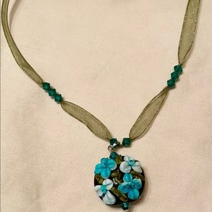 Bridgerton-style necklace/choker. Antique-gold tone on sheer green ribbon